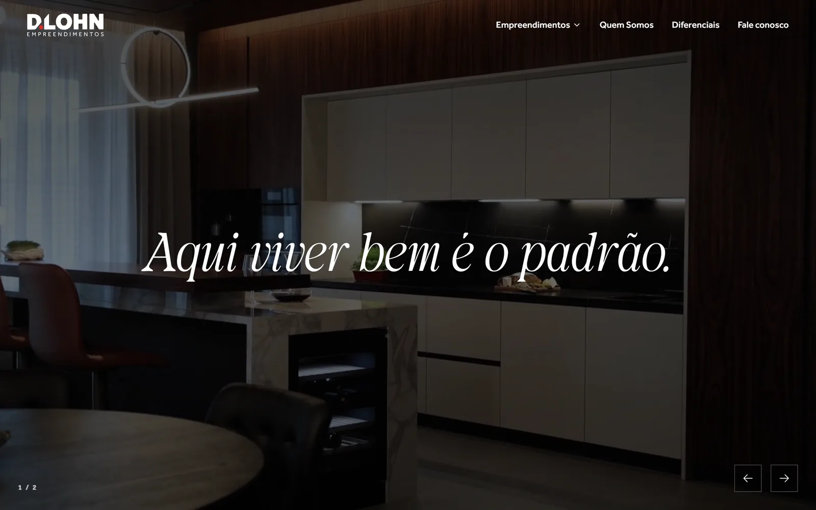 D.Lohn Empreendimentos homepage: a decorated apartment kitchen in the background with the slogan 'Aqui viver bem é o padrão.'